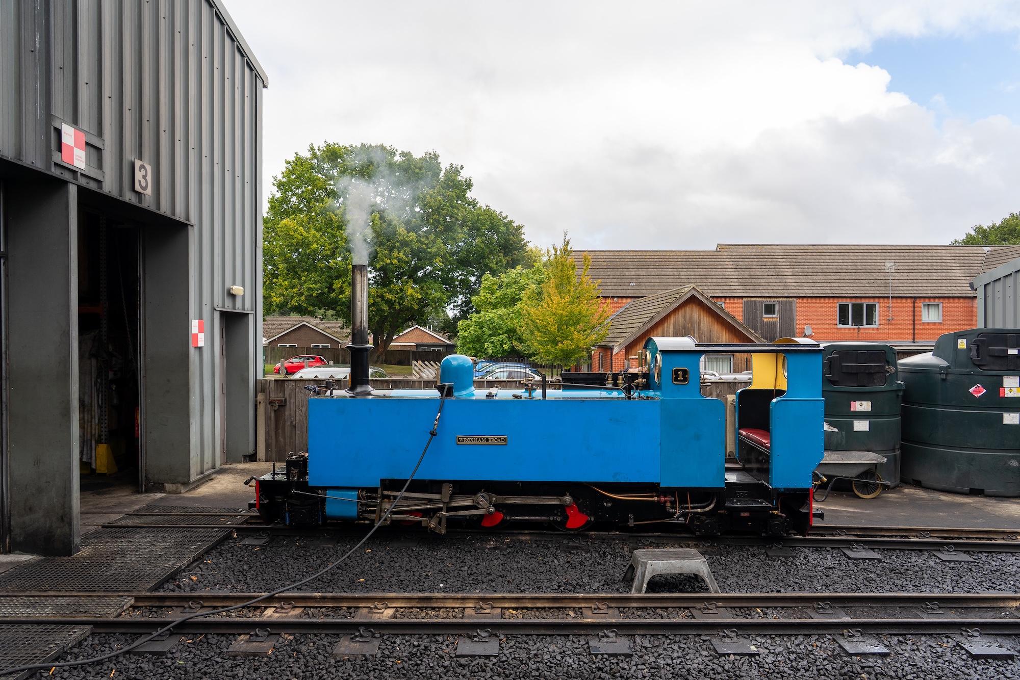 No. 1 “Wroxham Broad” Narrow Gauge Steam Locomotive Beside The Railway Workshop