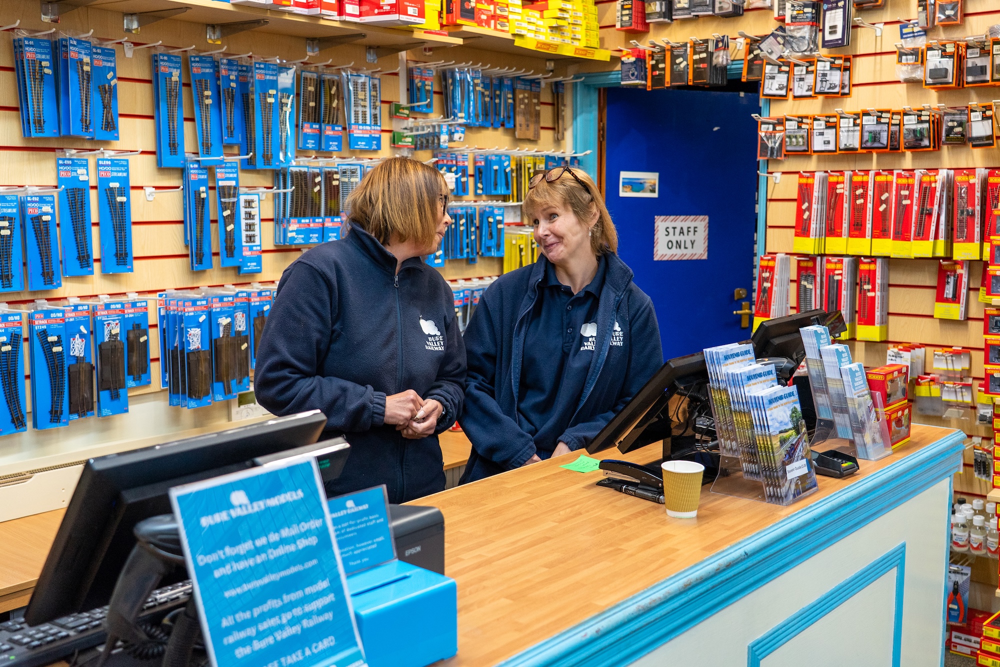 Friendly Shop And Ticket Office Staff Behind The Counter