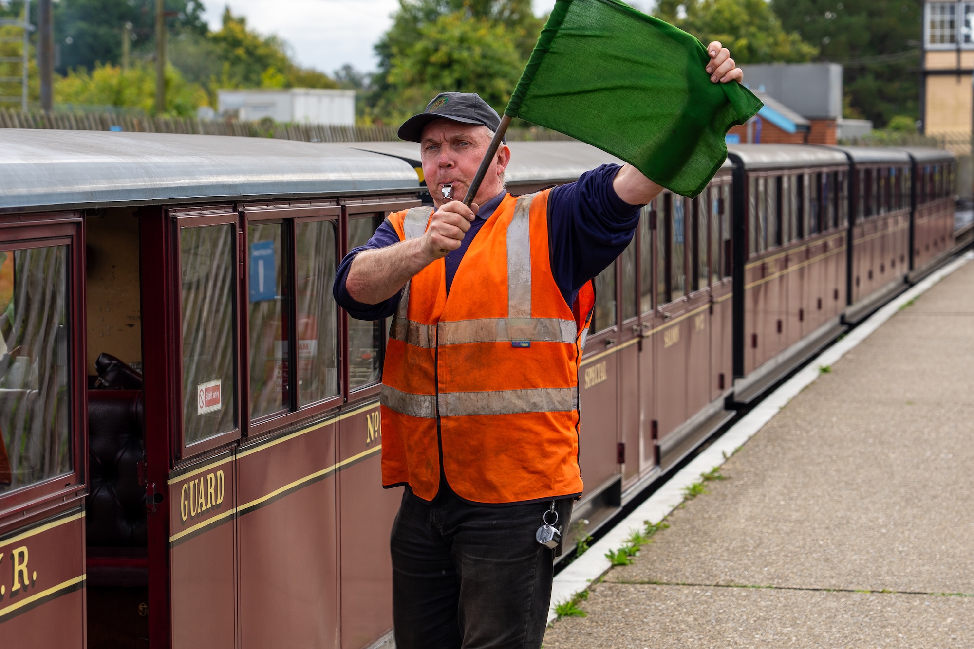 Green Flag Signalling To The Train Driver
