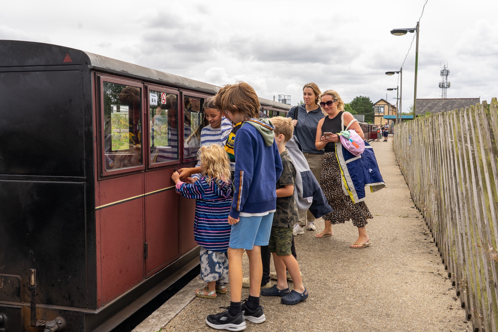 Children And Parents Boarding A Carriage