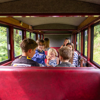 Children travelling to Wroxham Station by steam train