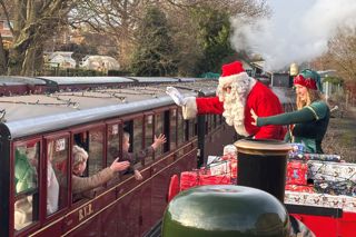 Father Christmas And His Elf Visiting For The Festive Express