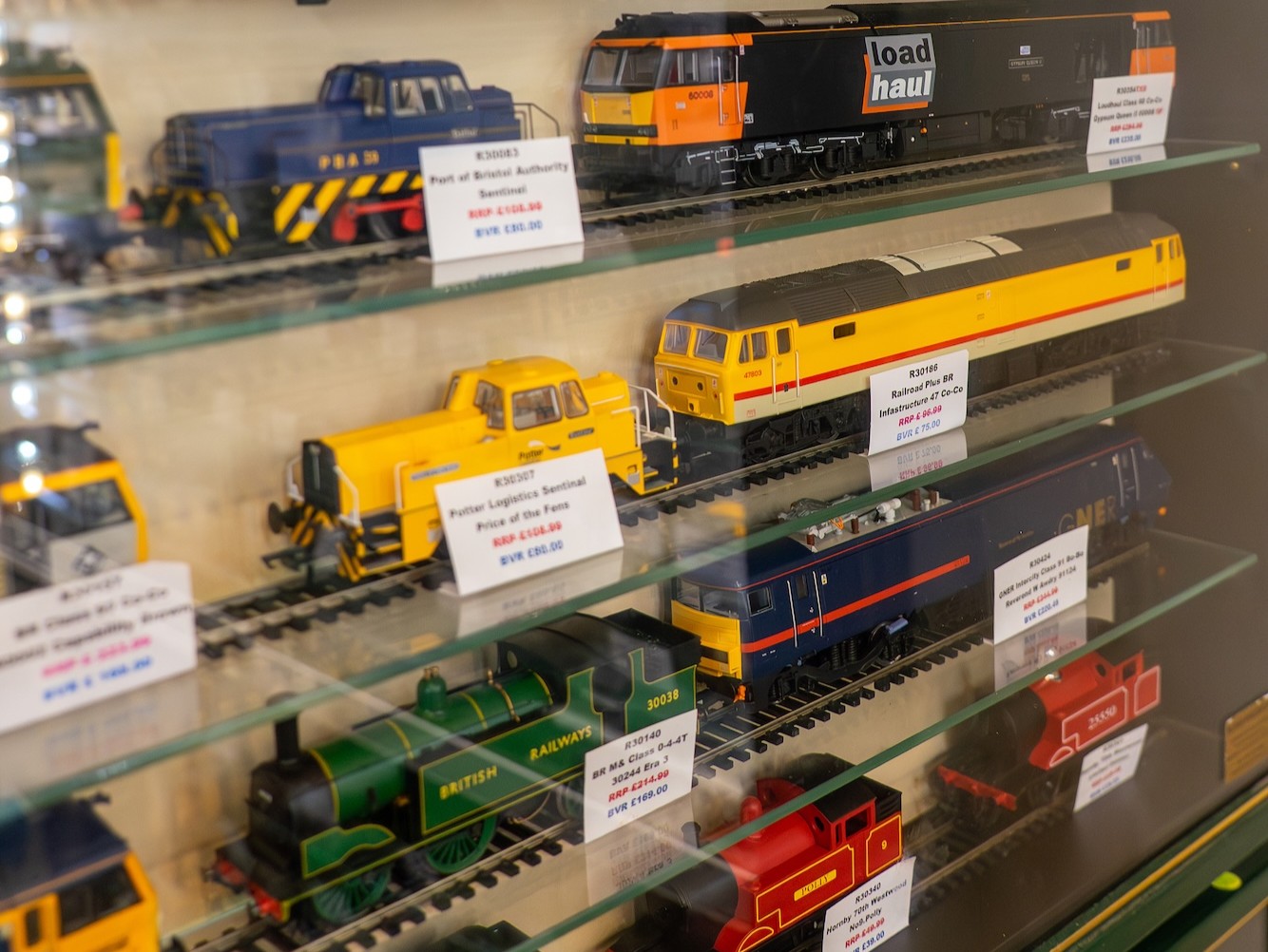 Model Locomotives And Railway Stock Displayed In Glass Cabinets