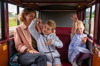 Mum With Son And Daughter In A Carriage