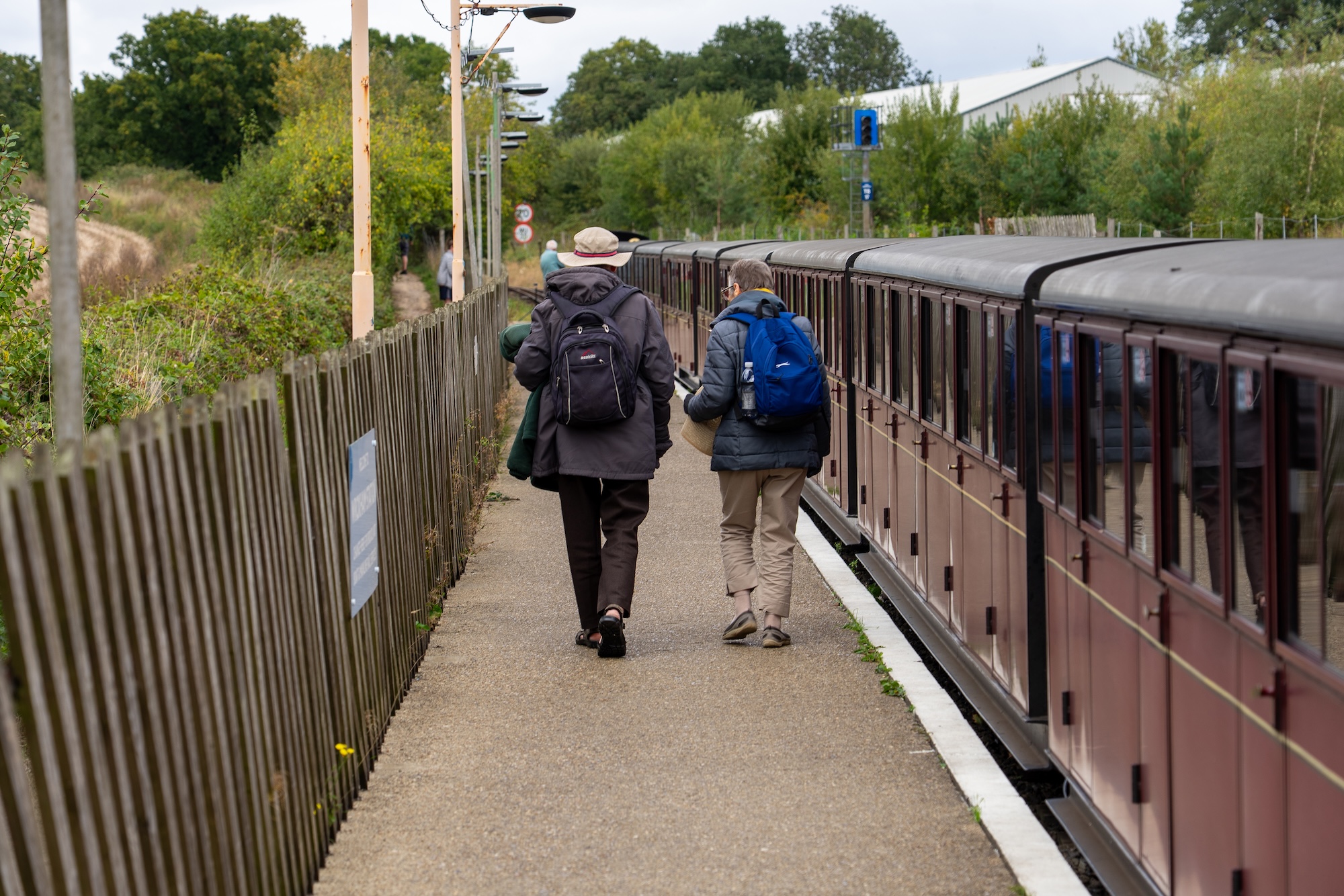 Two Adults Walking Along The Platform At Wroxham