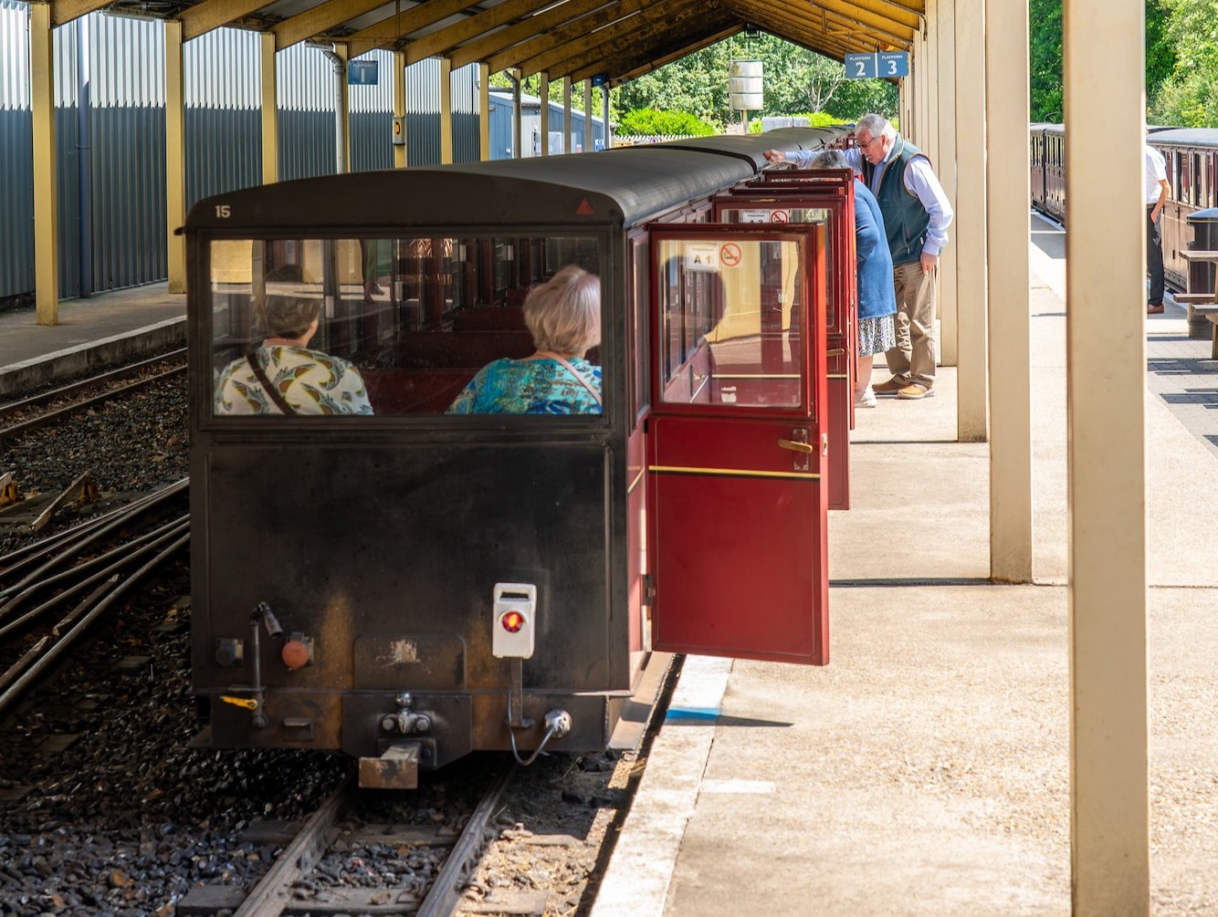 Carriages At The Platform With Passengers