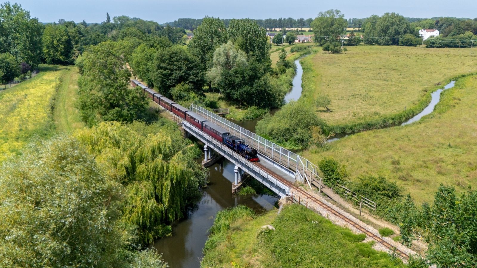 Blickling Hall On The Line Traveling Over The Bridge On The River Bure